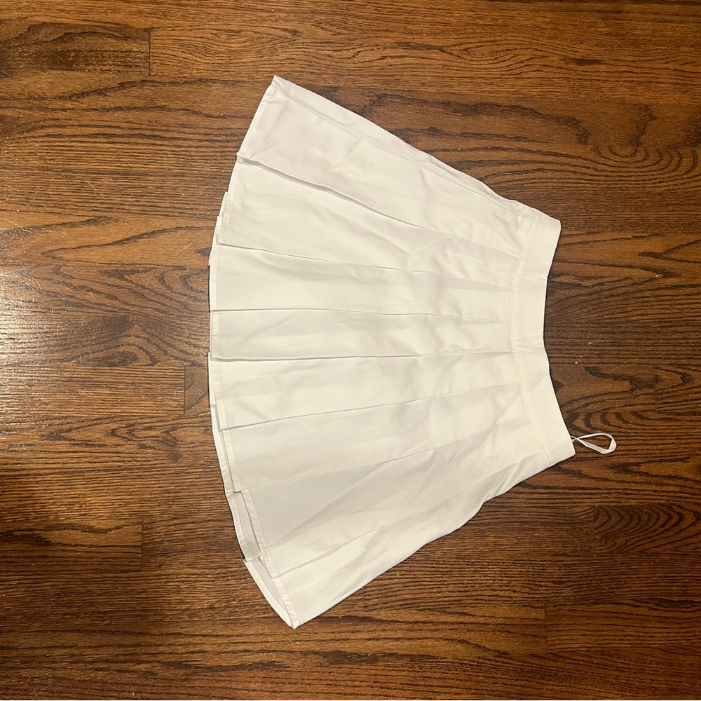 White pleated skirt. Never worn.